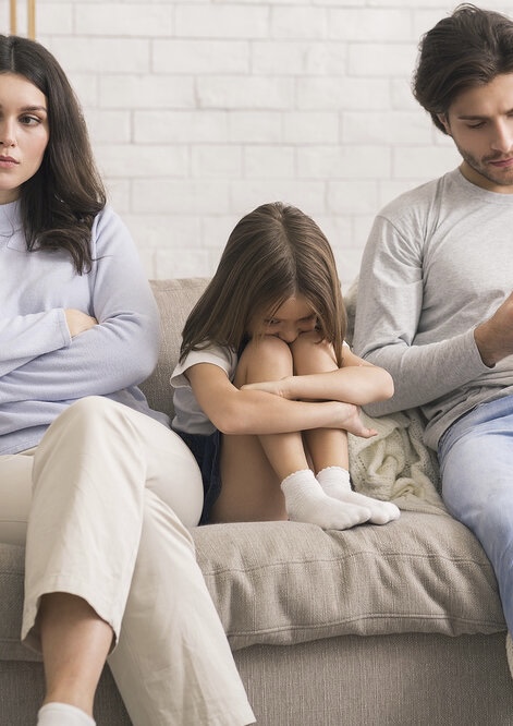 Family Counselling Concept. Unhappy Man And Woman And Their Upset Little Daughter Sitting At Psychol
